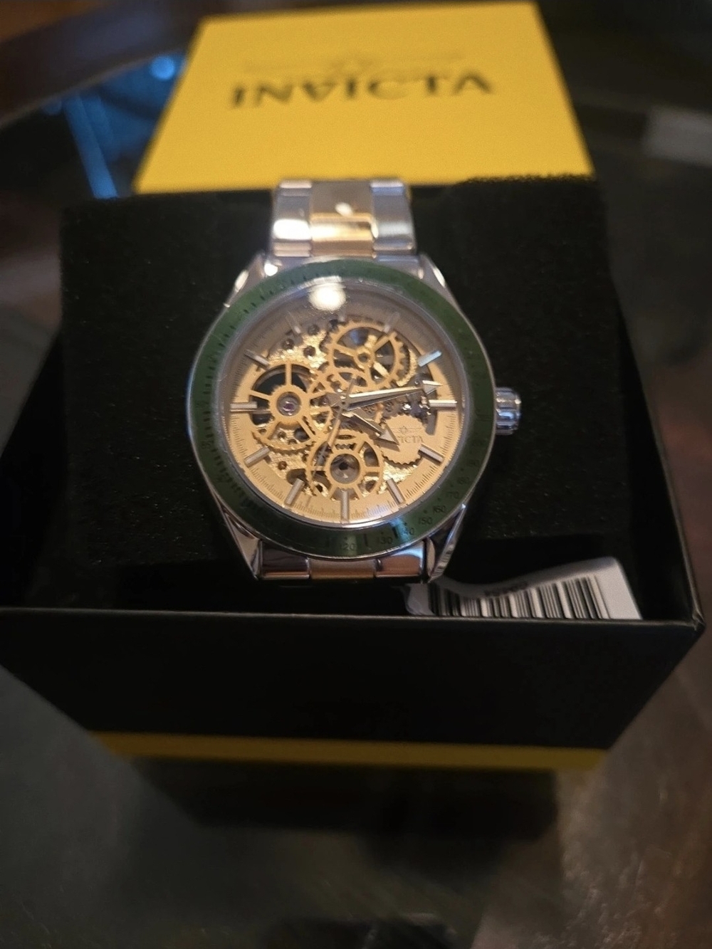 Invicta Two-Tone Skeleton Dial Watch with Green Bezel